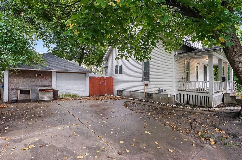 Side view, driveway and garage of the Boston Avenue home